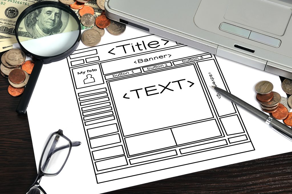 Paper wireframe layout for planning a small business website homepage