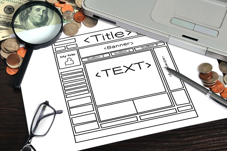 Paper wireframe layout for planning a small business website homepage