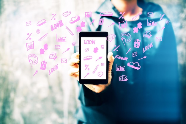 Hand holding smartphone with social media icons